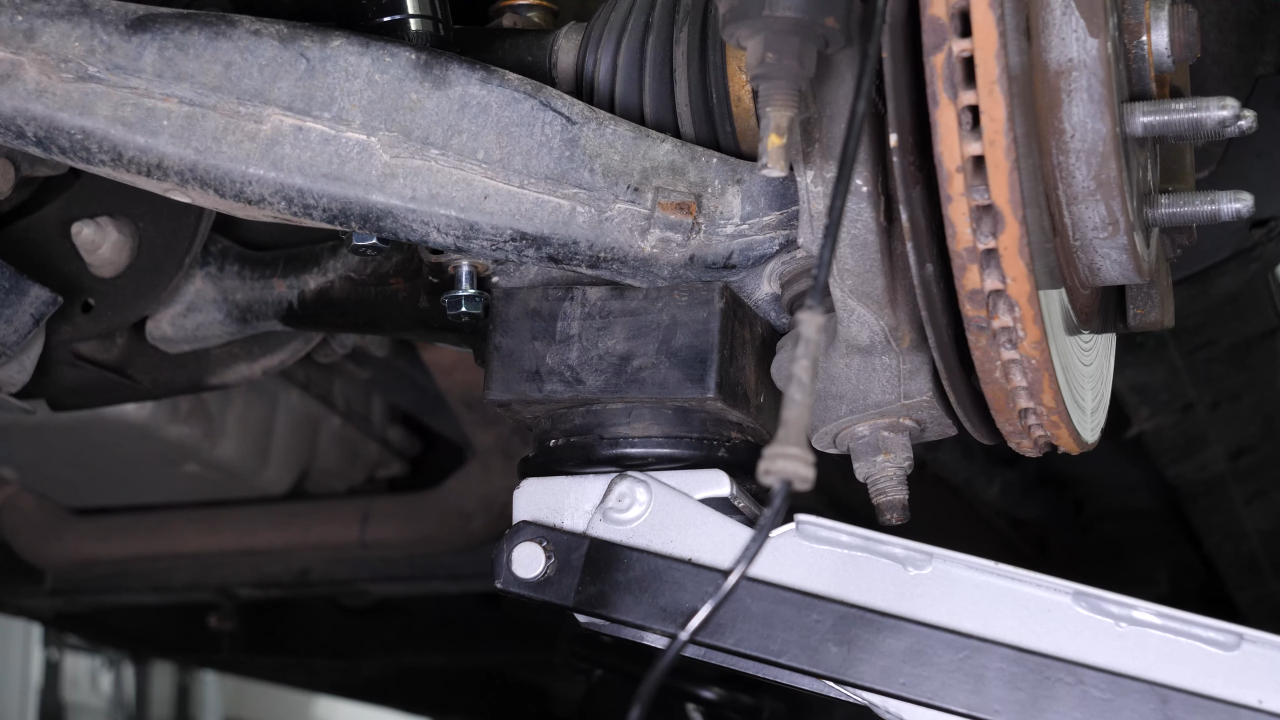 Put the control arm ball joint back