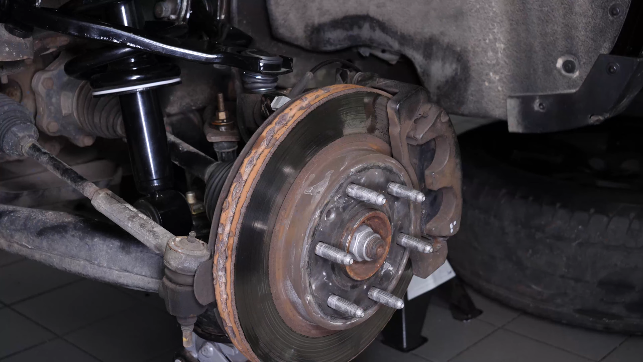 Put the control arm ball joint back