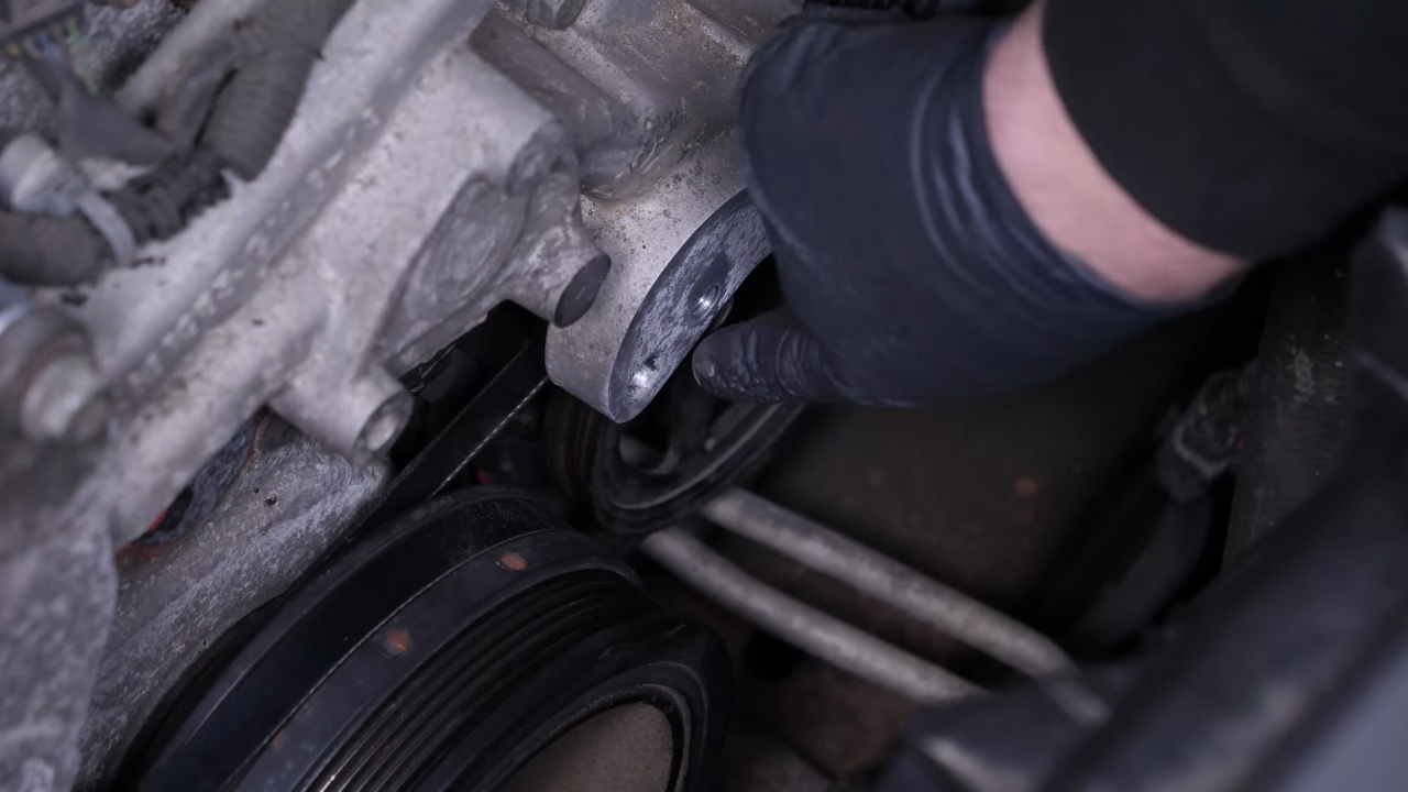 Put the belt tensioner back