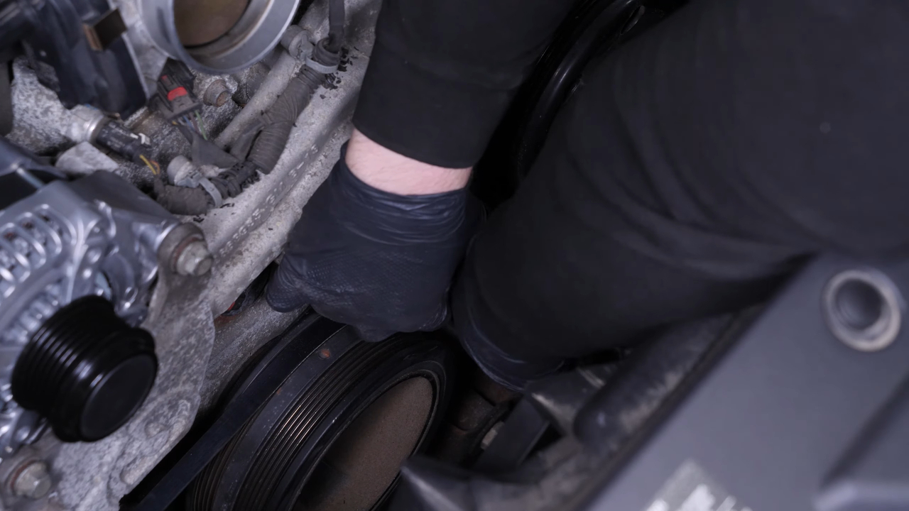 Put the belt tensioner back
