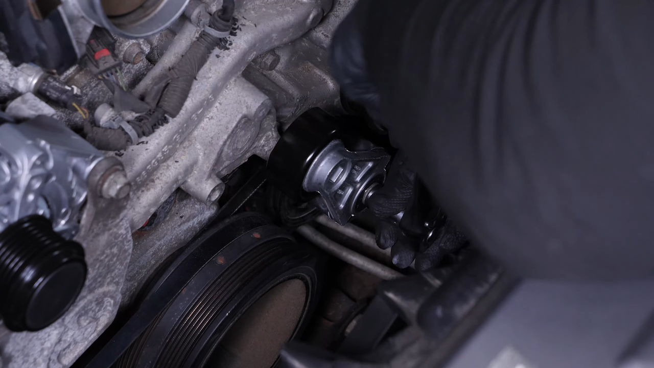 Put the belt tensioner back