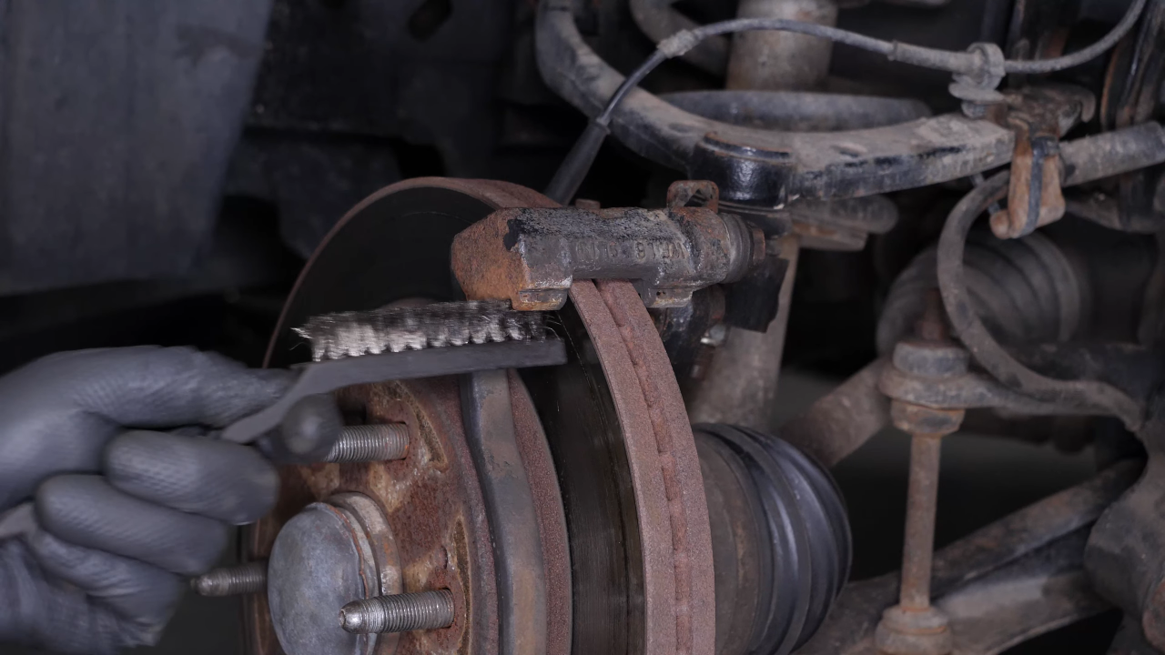 Clean the brake caliper mount