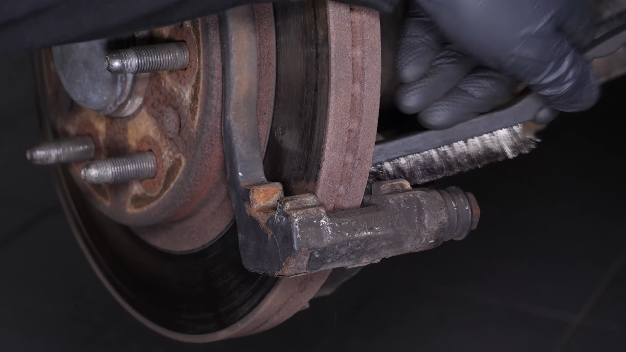 Clean the brake caliper mount