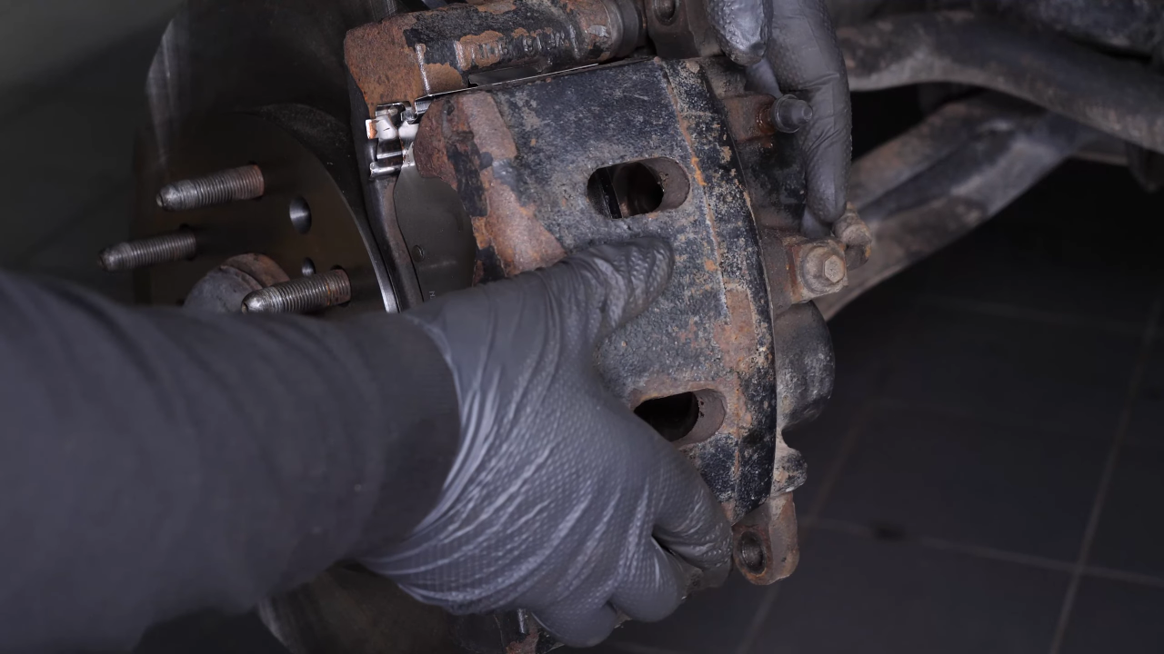Put the brake caliper back