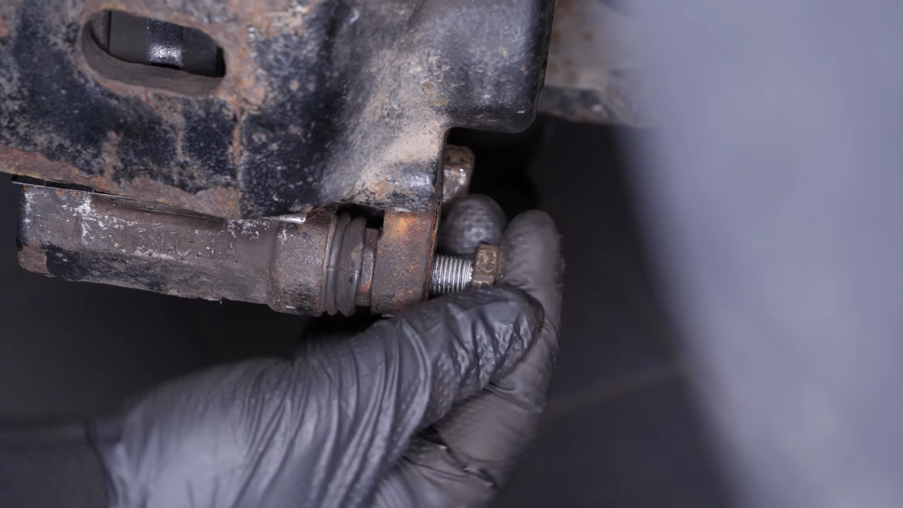 Put the brake caliper back