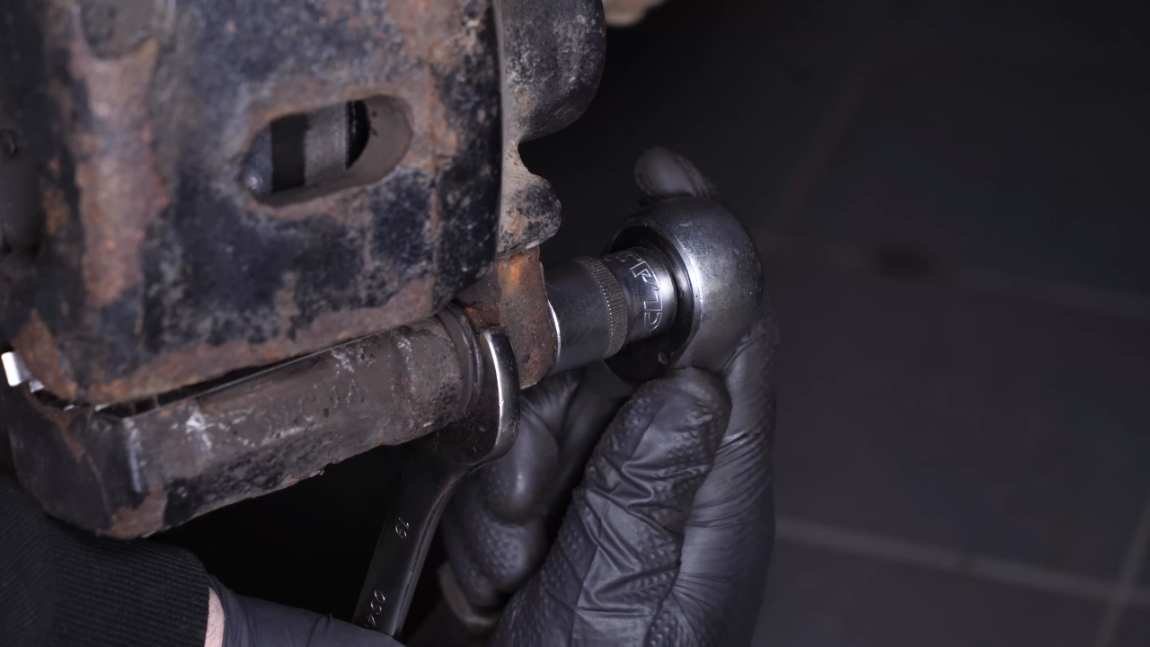 Put the brake caliper back
