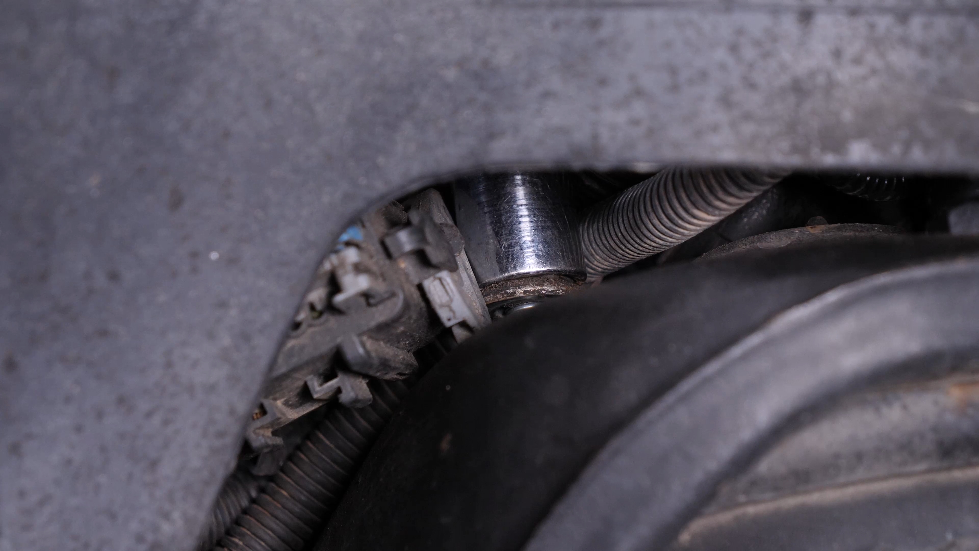 Unscrew the strut mount bearing nuts