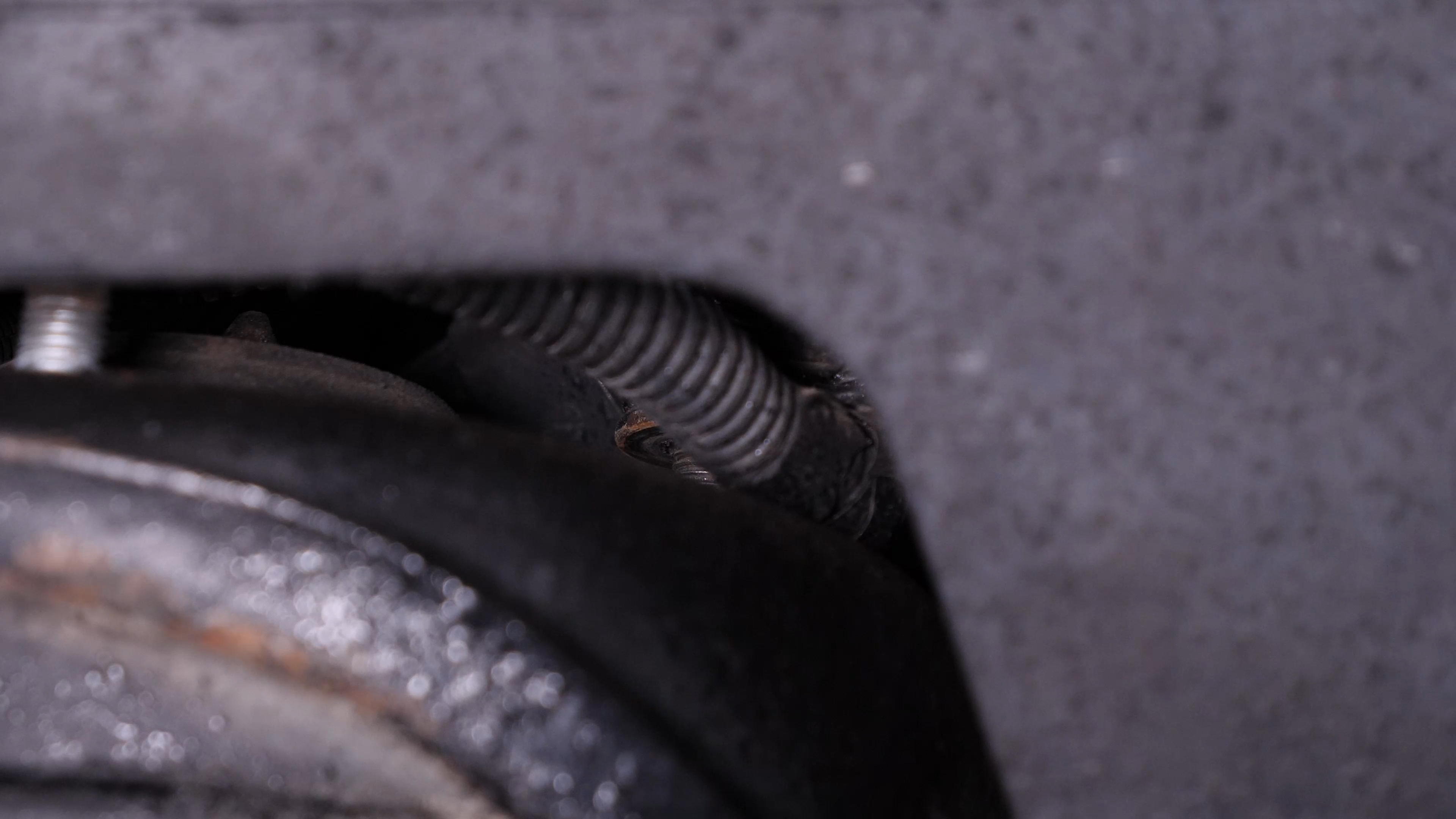 Unscrew the strut mount bearing nuts