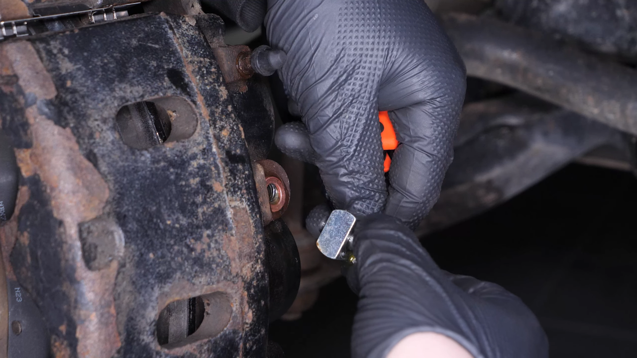 Unscrew the brake hose from the brake caliper