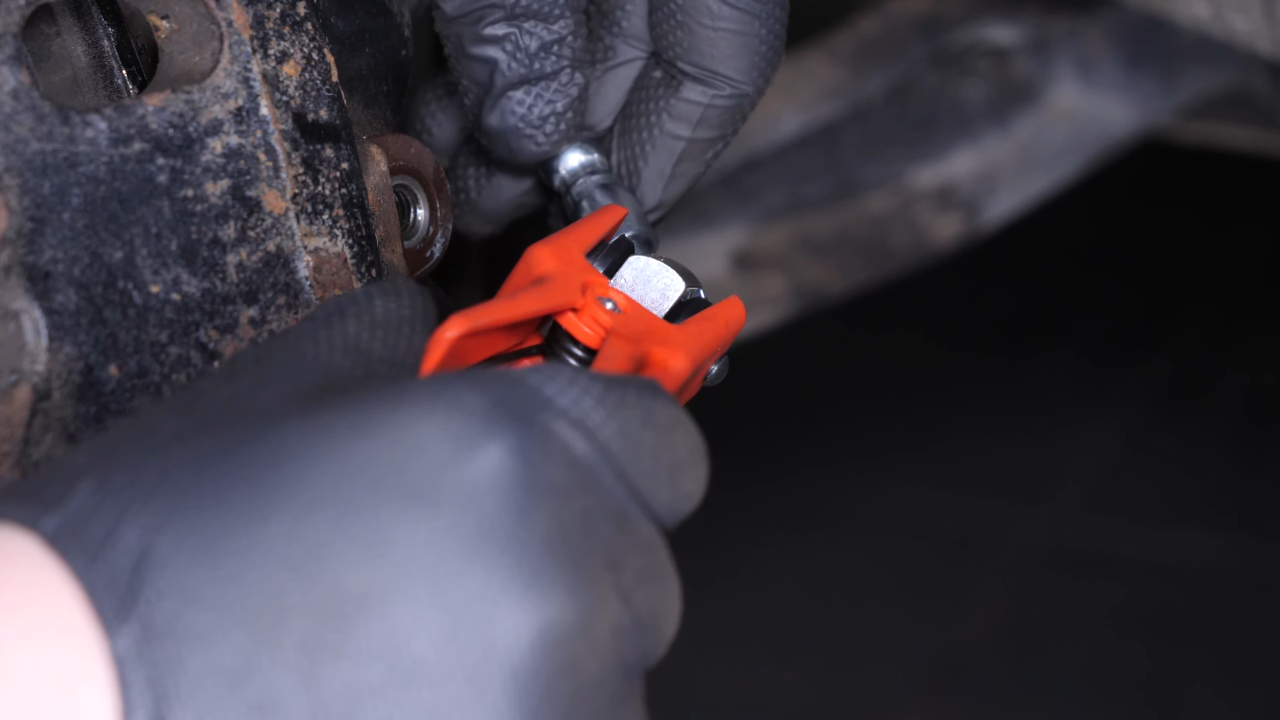Unscrew the brake hose from the brake caliper