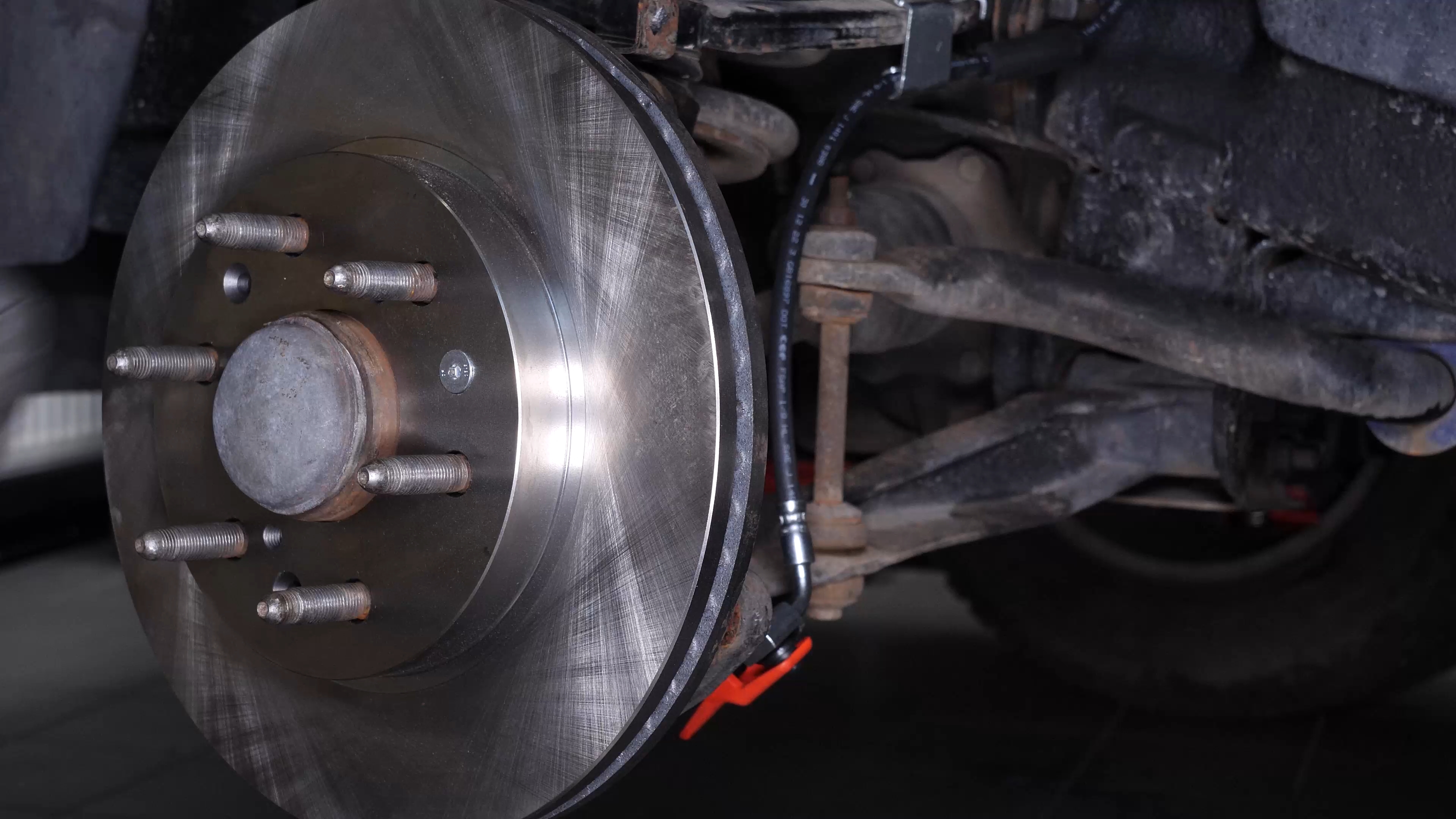 Remove the  brake caliper mount