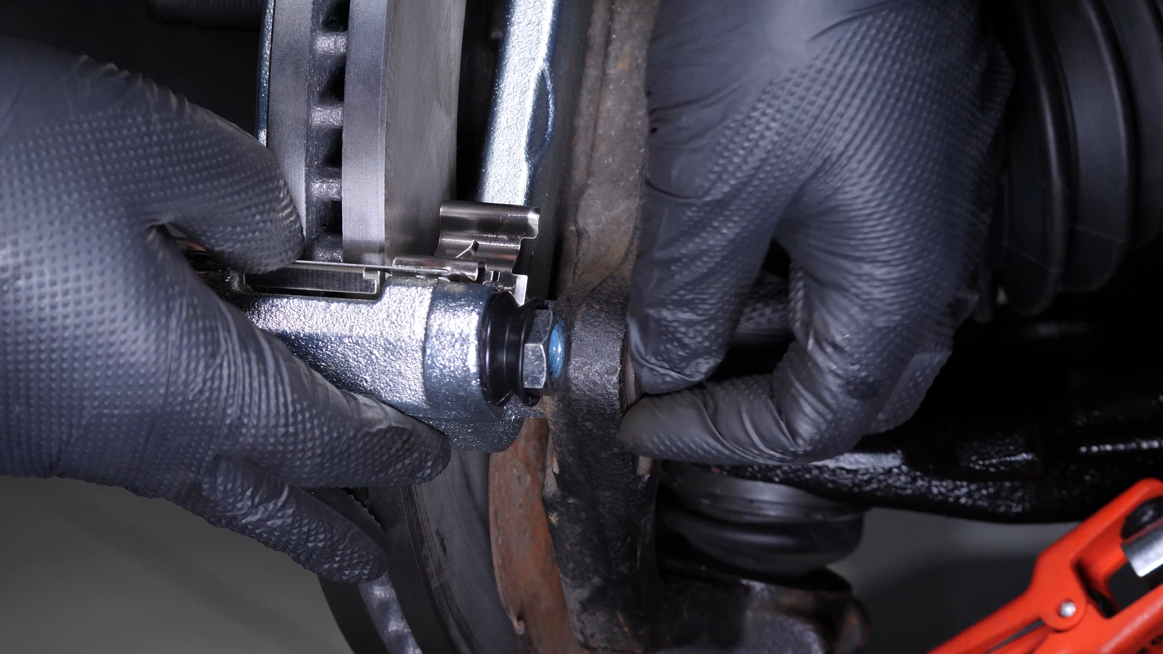 Put the brake caliper mount back on
