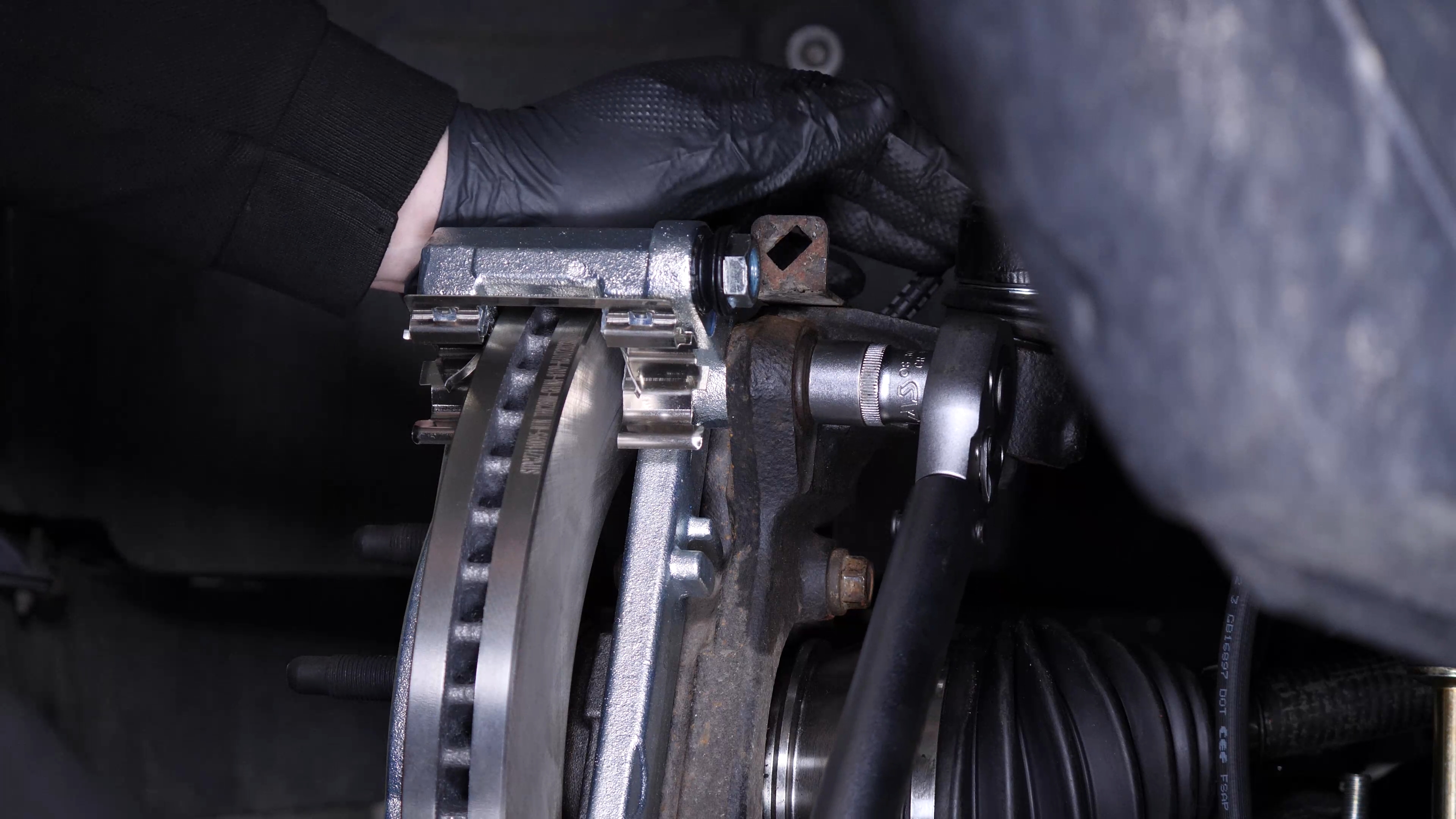 Put the brake caliper mount back on