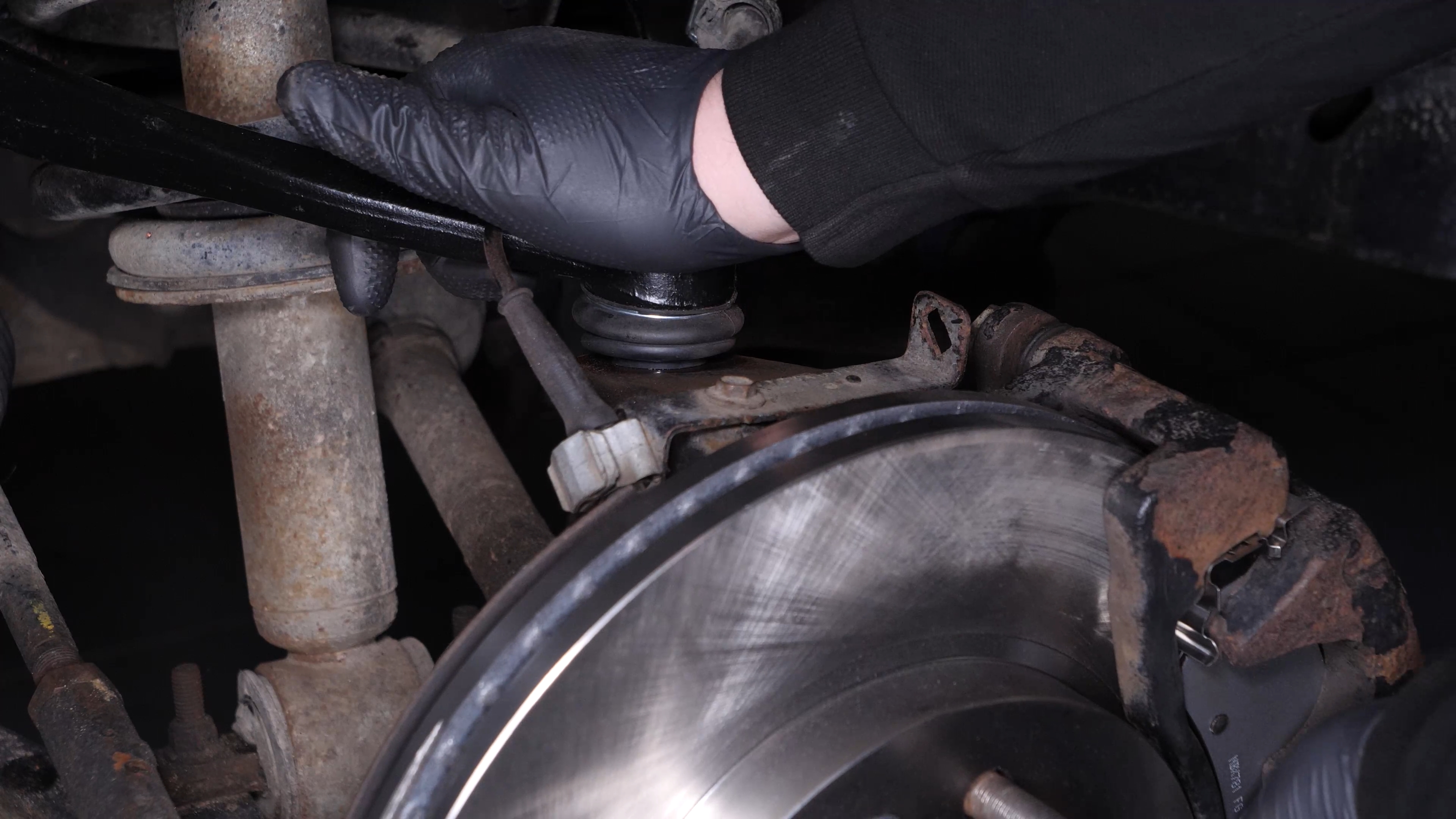 Put the control arm ball joint back