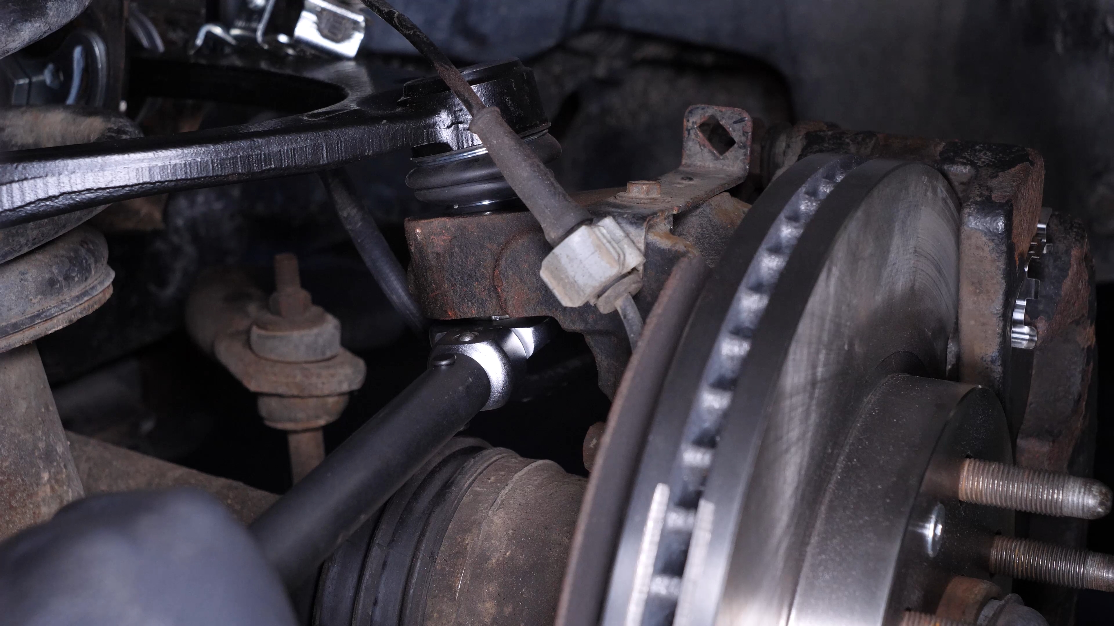 Put the control arm ball joint back