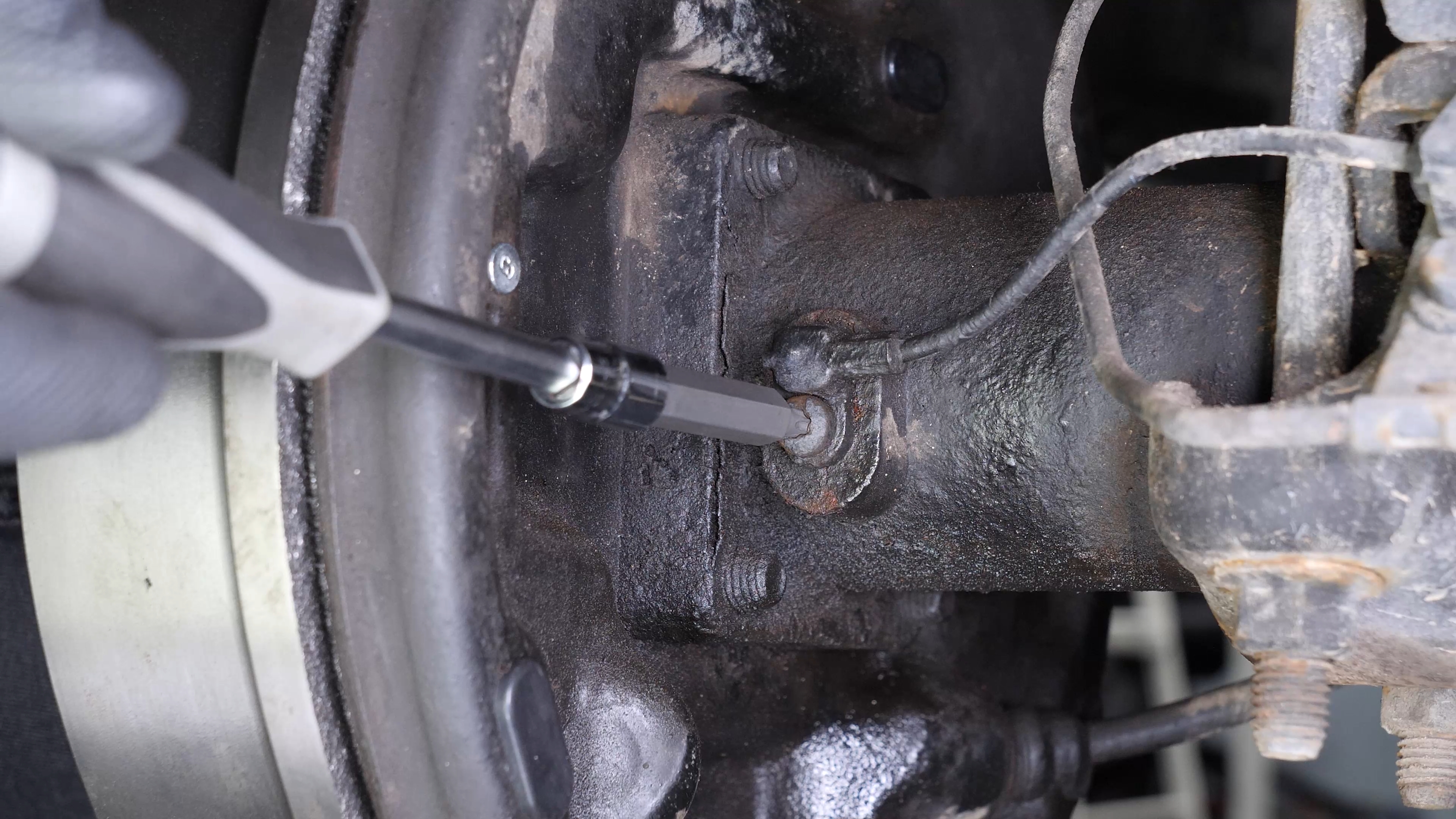 Remove the ABS sensor from the rear axle
