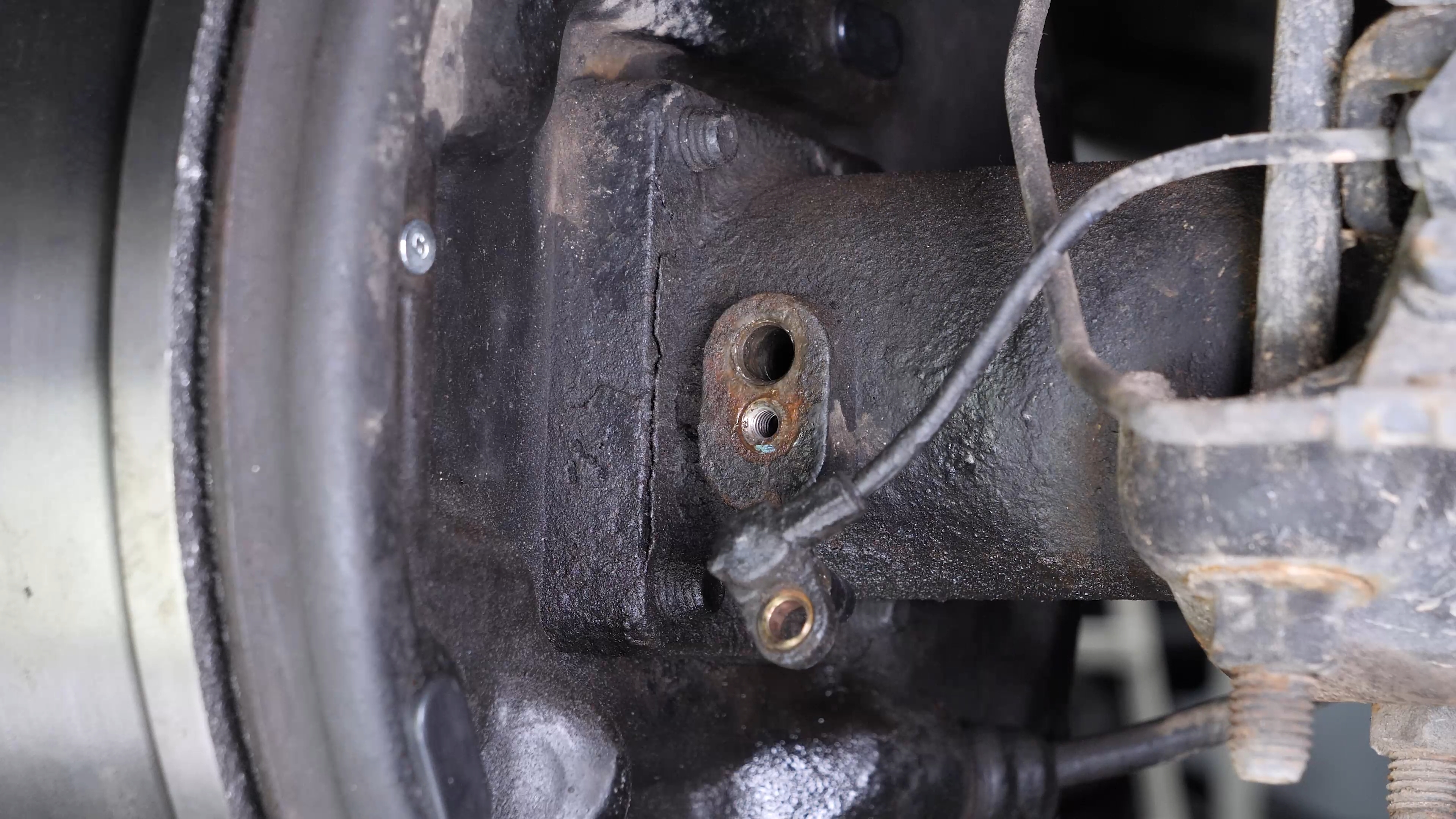Remove the ABS sensor from the rear axle