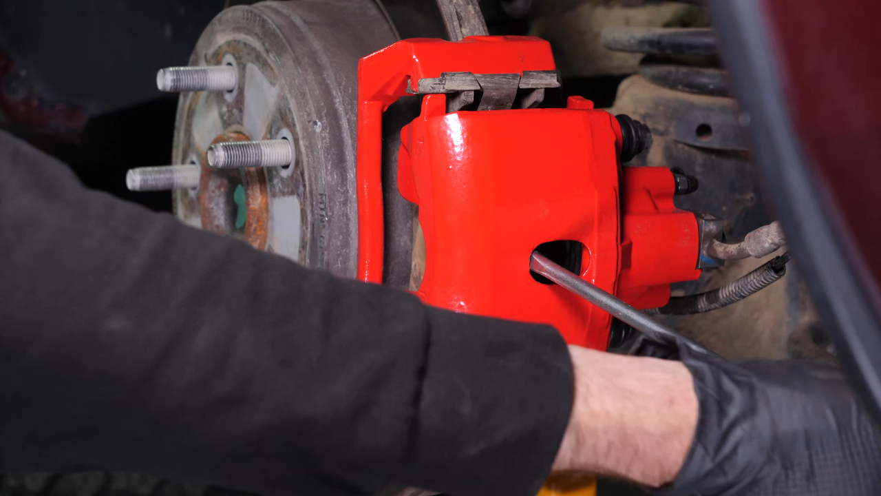 Remove the rear brake system