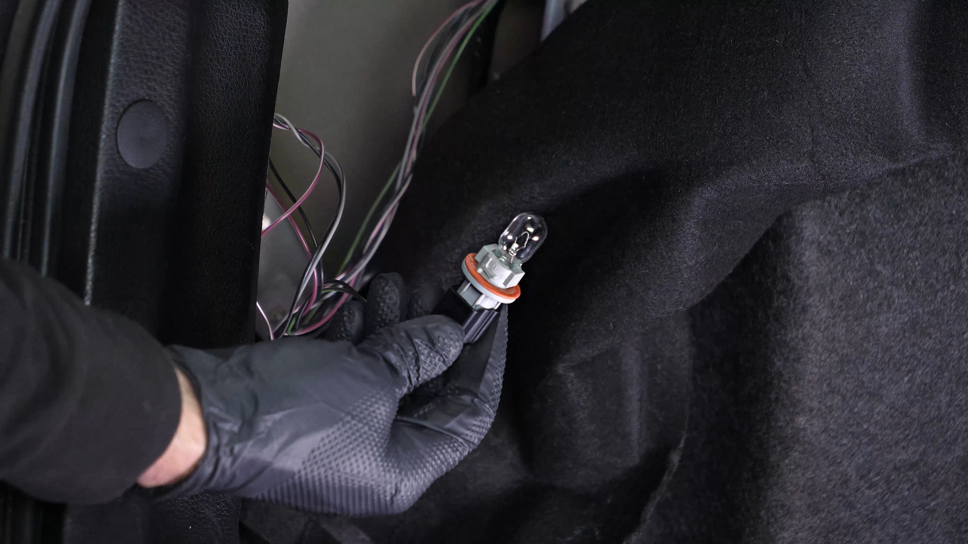 Replace the reverse light bulb