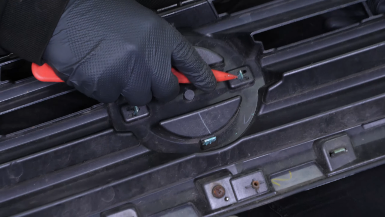 Remove the emblem.