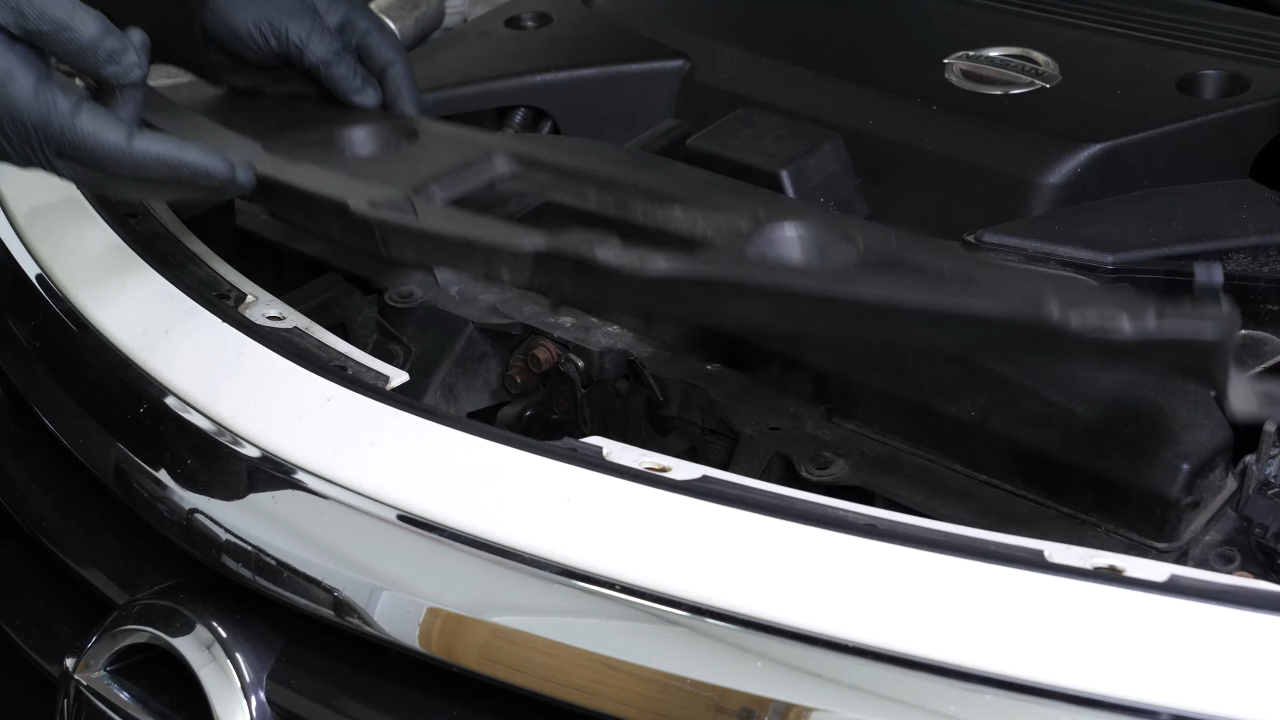 Remove the radiator support cover