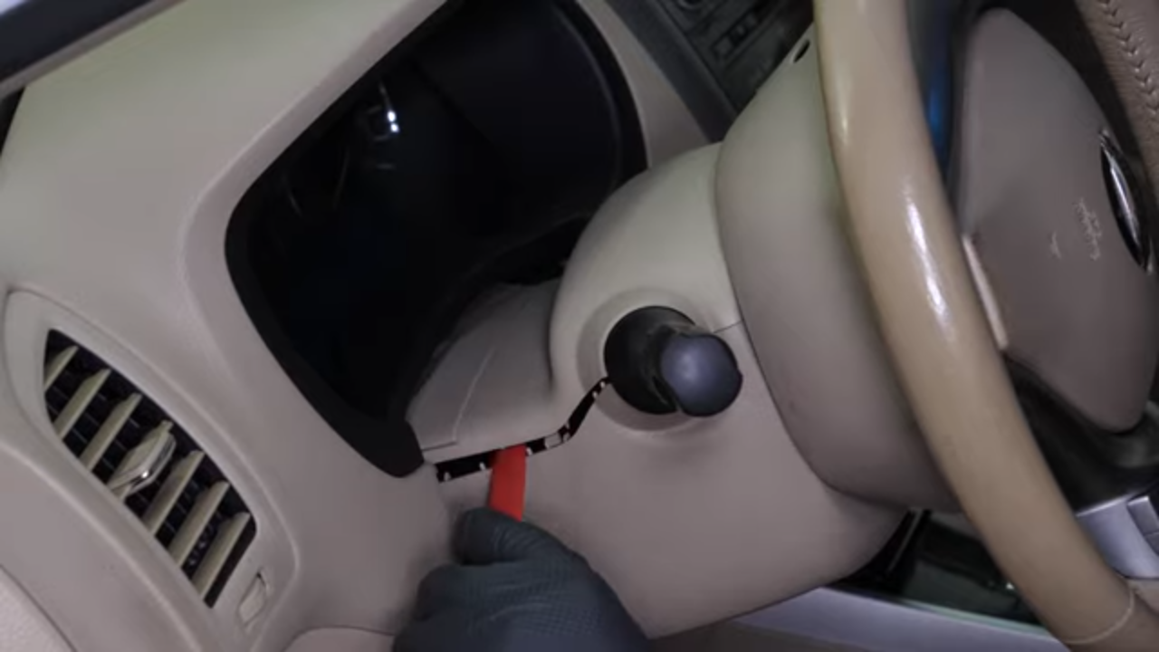 Remove the steering column cover
