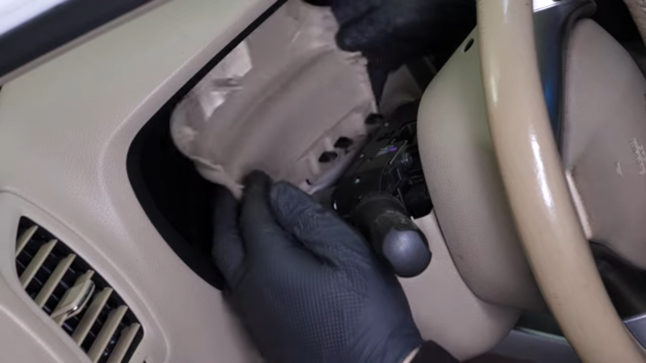 Remove the steering column cover
