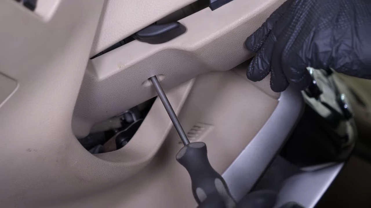 Put the steering column cover back