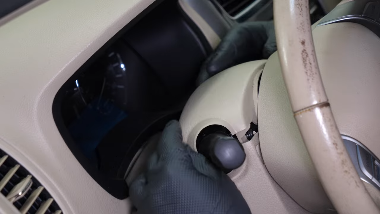 Put the steering column cover back