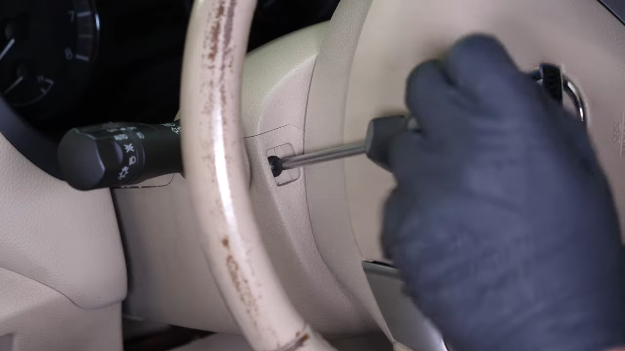 Put the steering column cover back