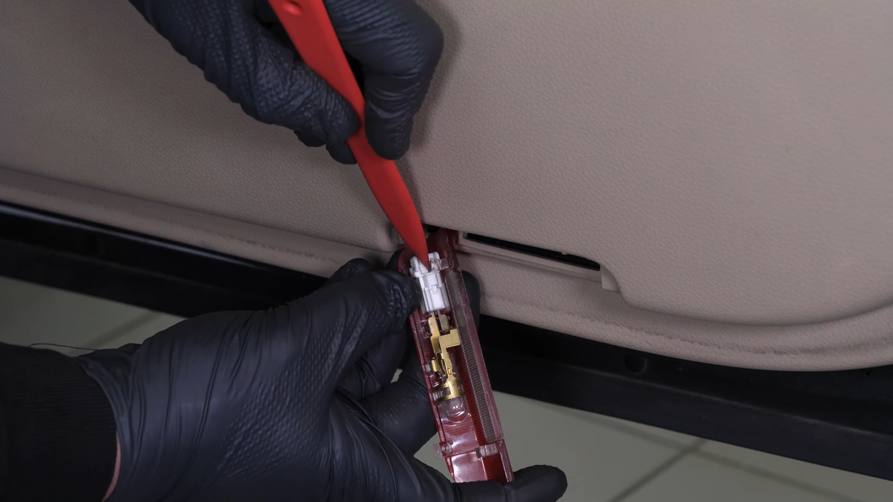 Disconnect the sidelight connector