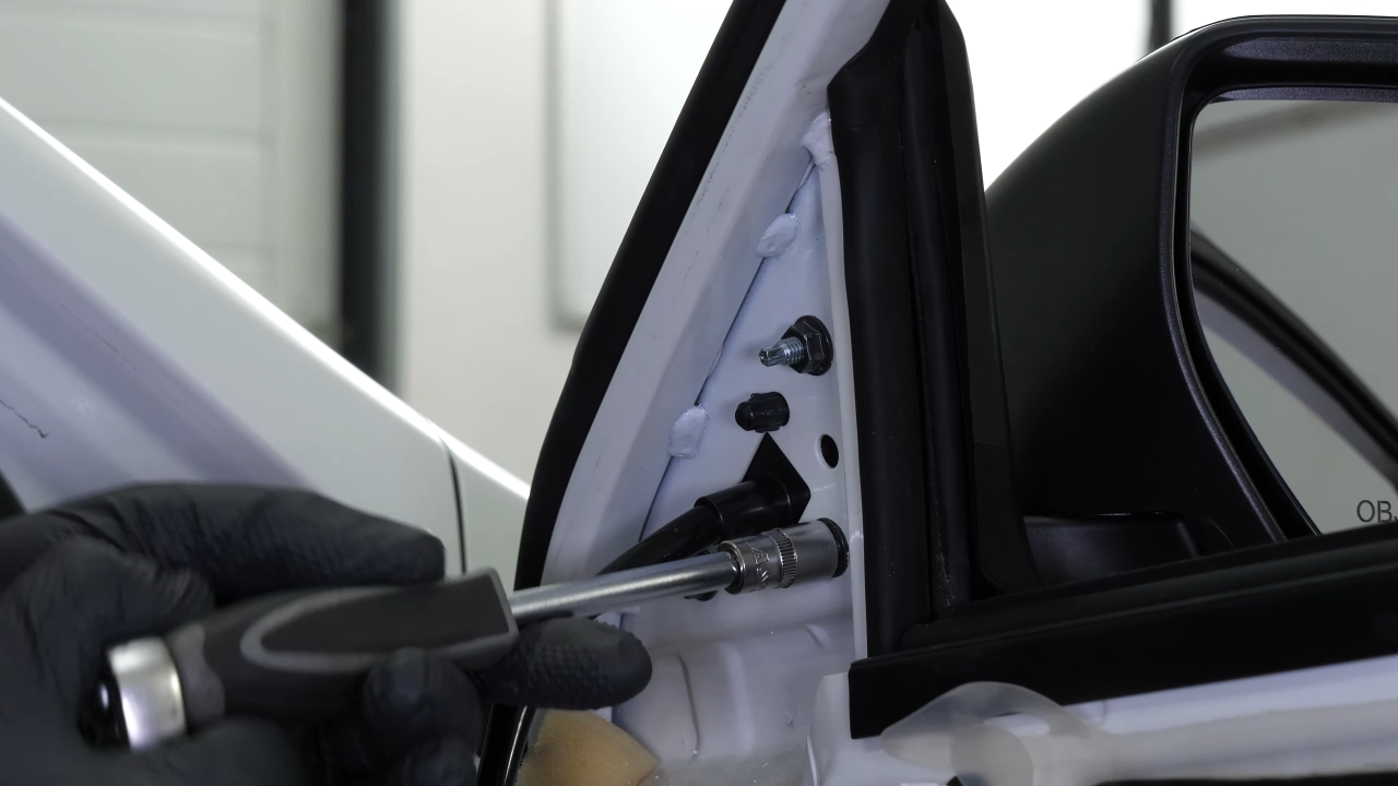 Install the new side view mirror