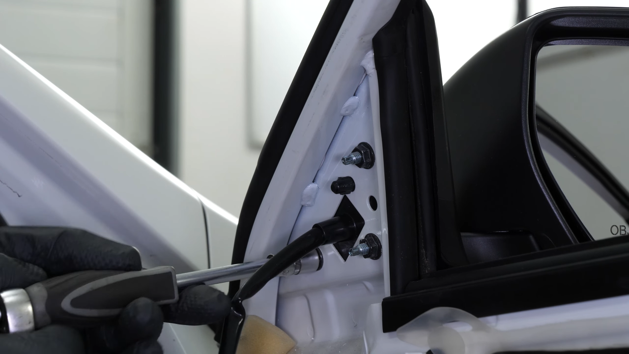 Install the new side view mirror