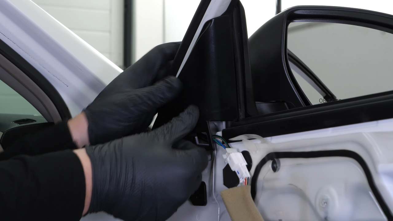 Install the new side view mirror
