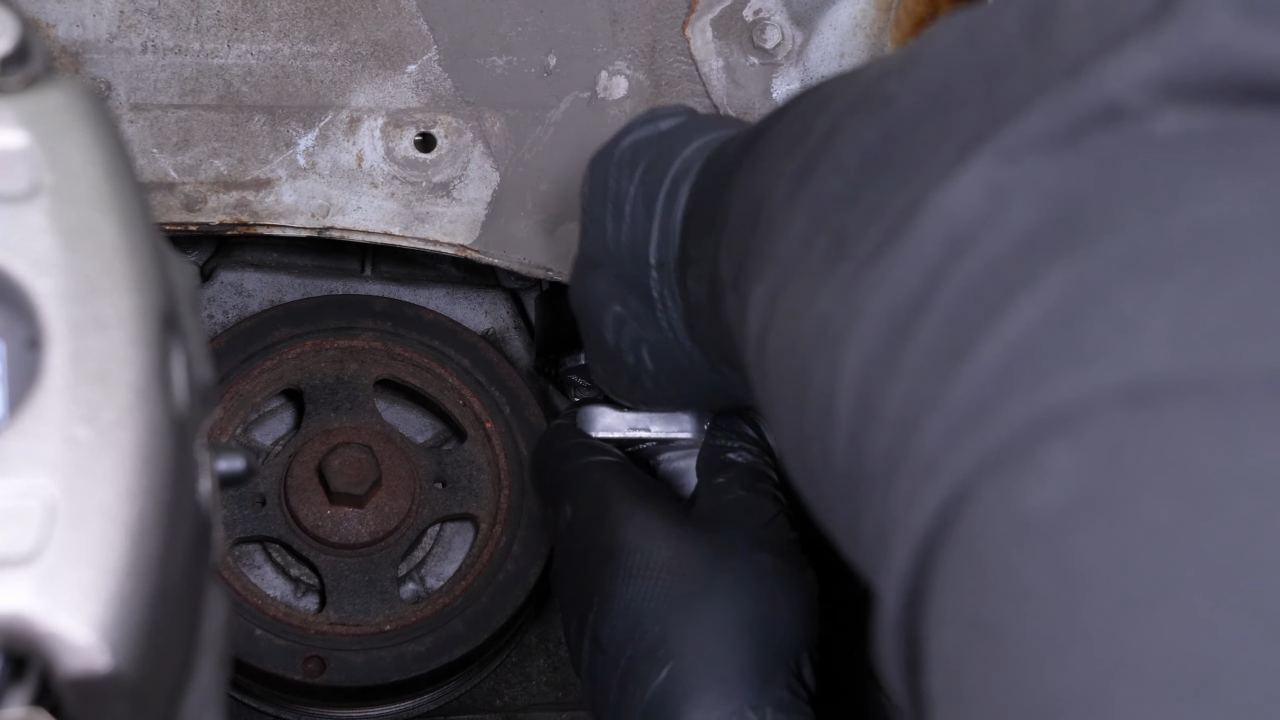 Install the new tensioner pulley