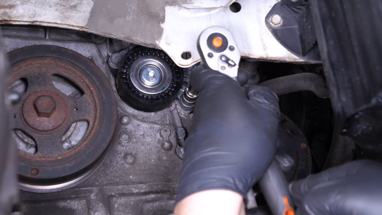 Install the new tensioner pulley
