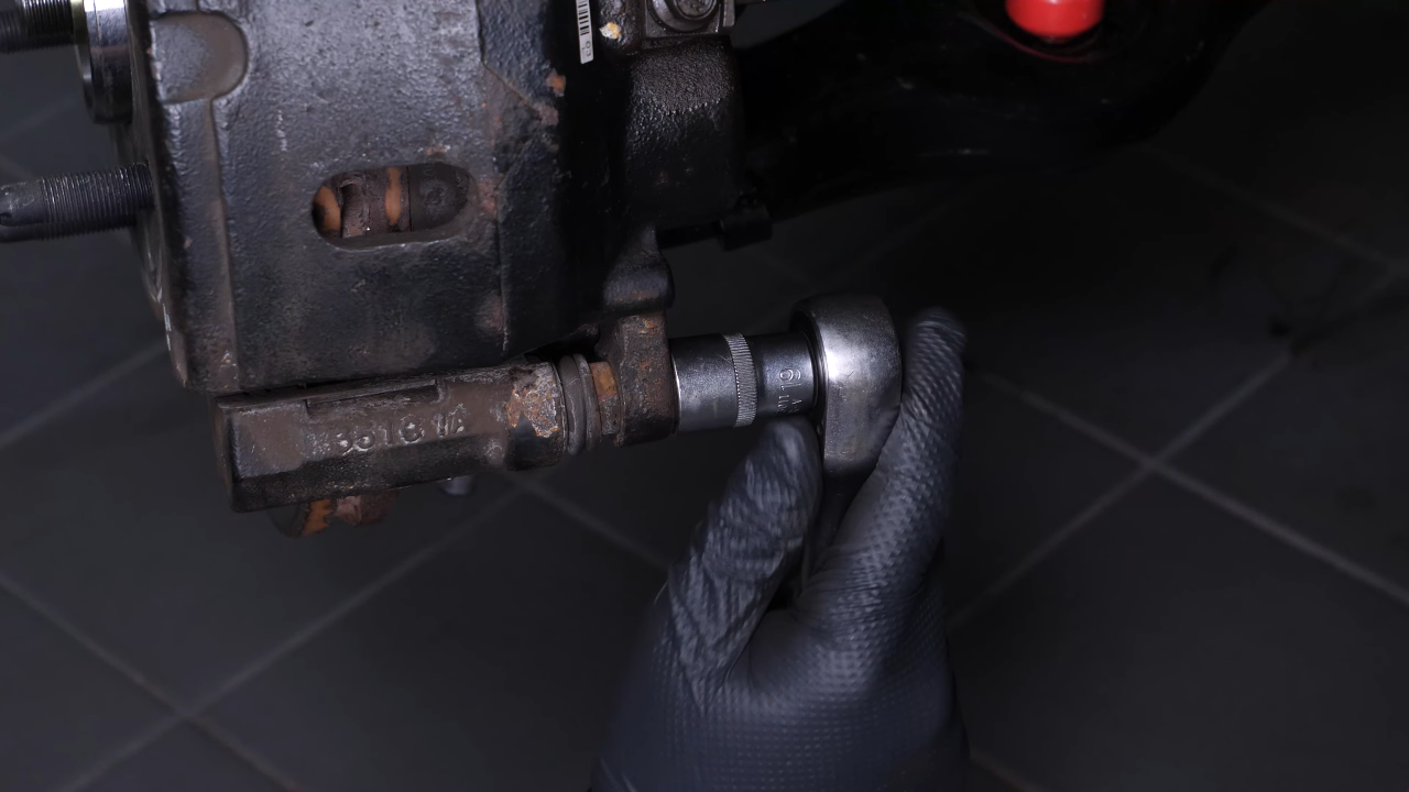 Remove the  brake caliper