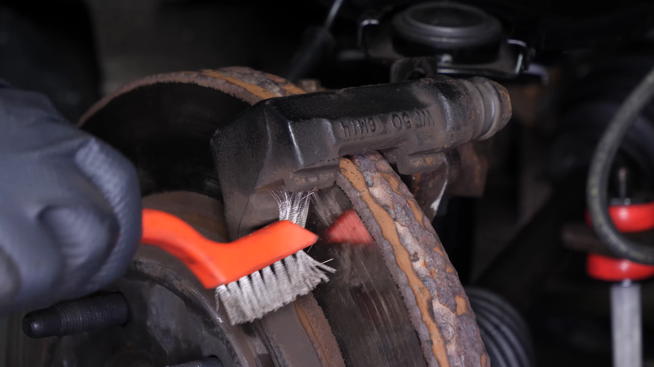 Clean the brake caliper mount
