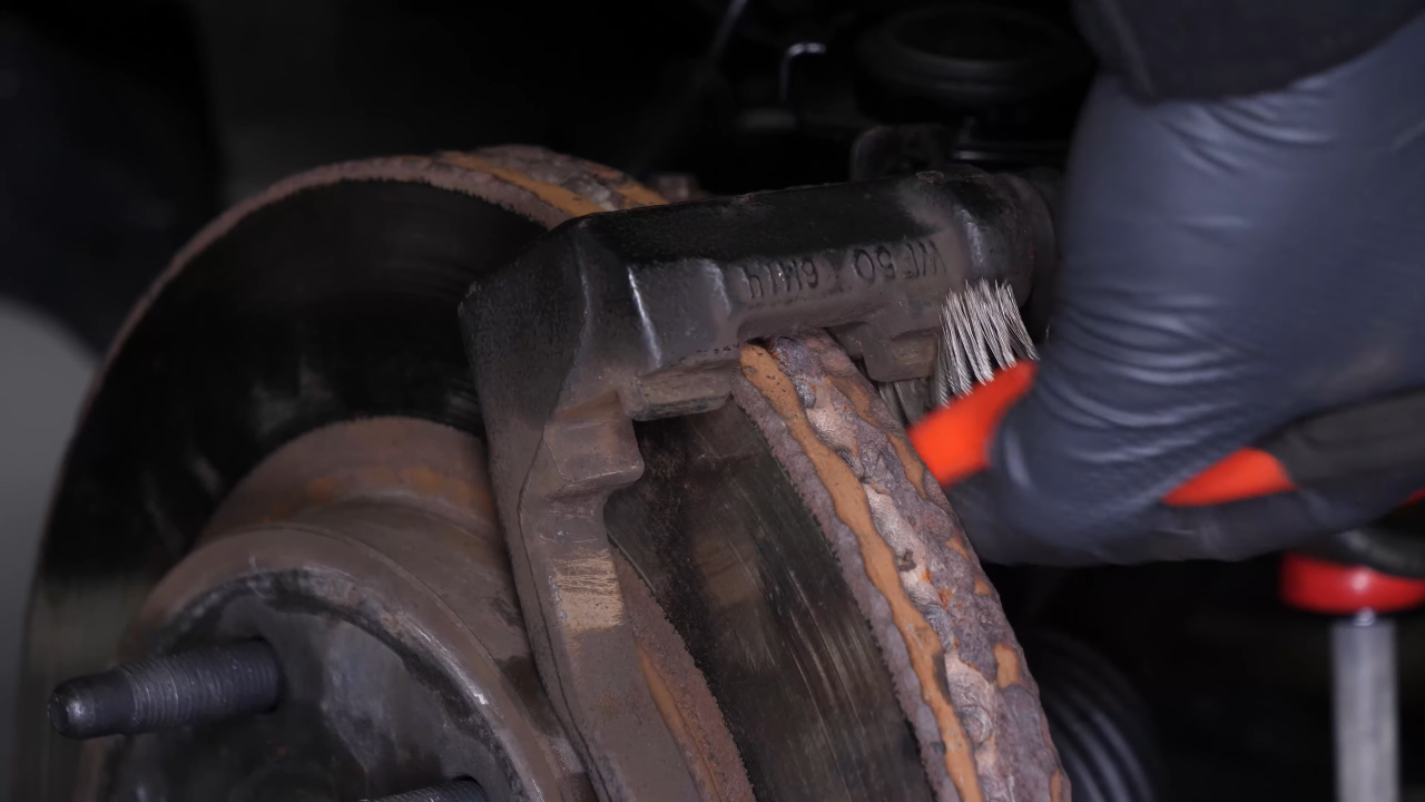 Clean the brake caliper mount