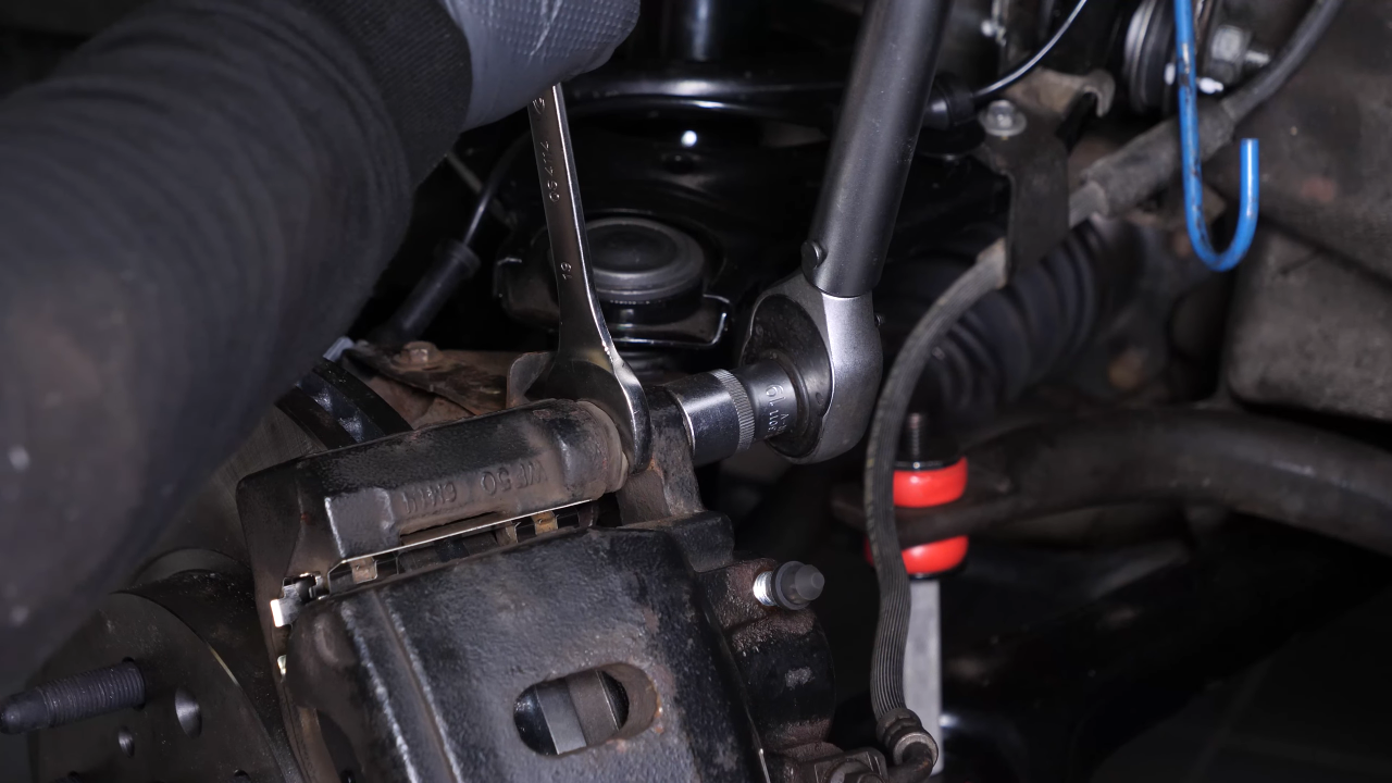 Put the brake caliper back