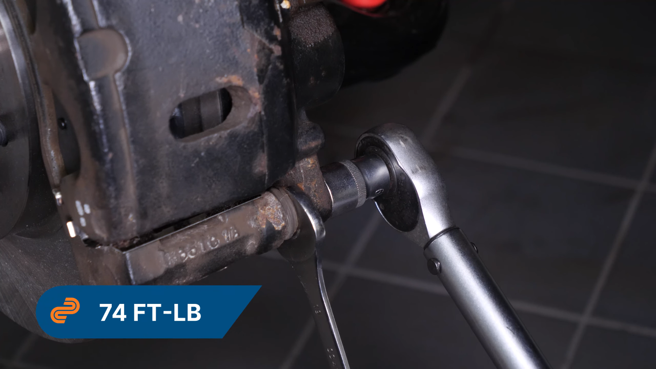Put the brake caliper back