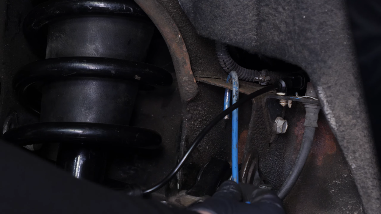 Hang the brake caliper on the strut