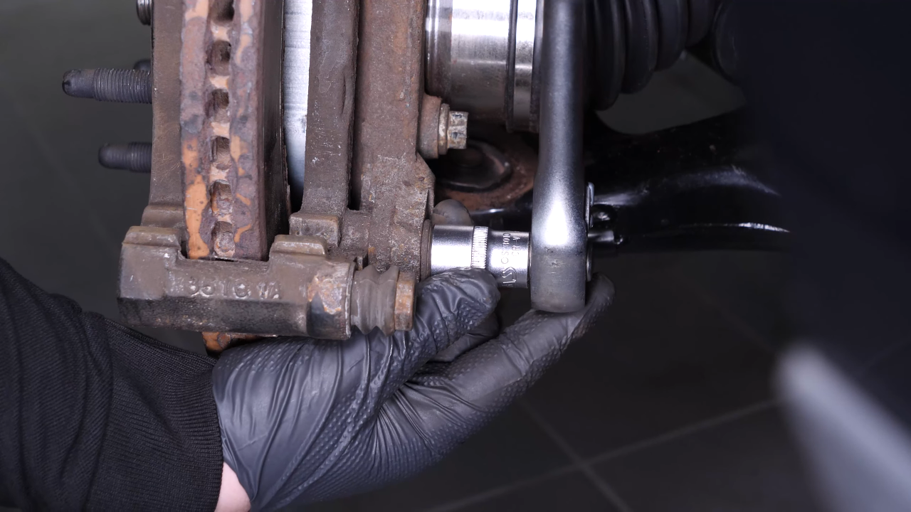 Remove the  brake caliper mount