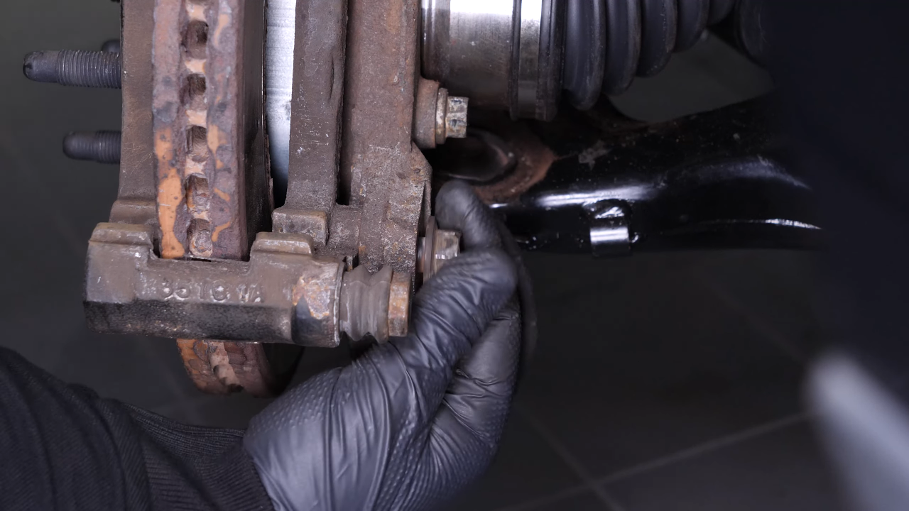 Remove the  brake caliper mount