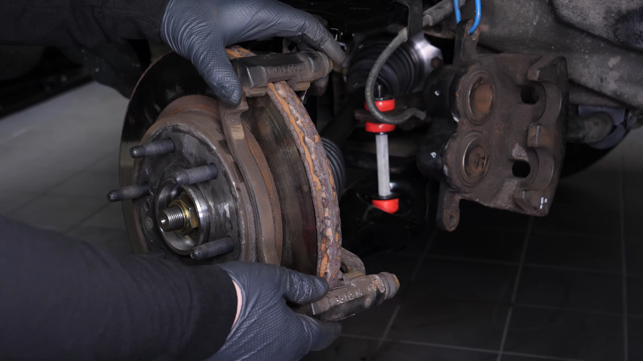 Remove the  brake caliper mount