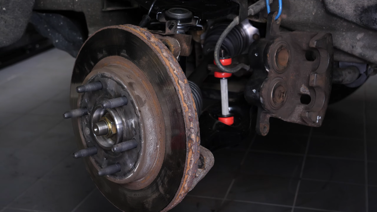 Remove the  brake caliper mount