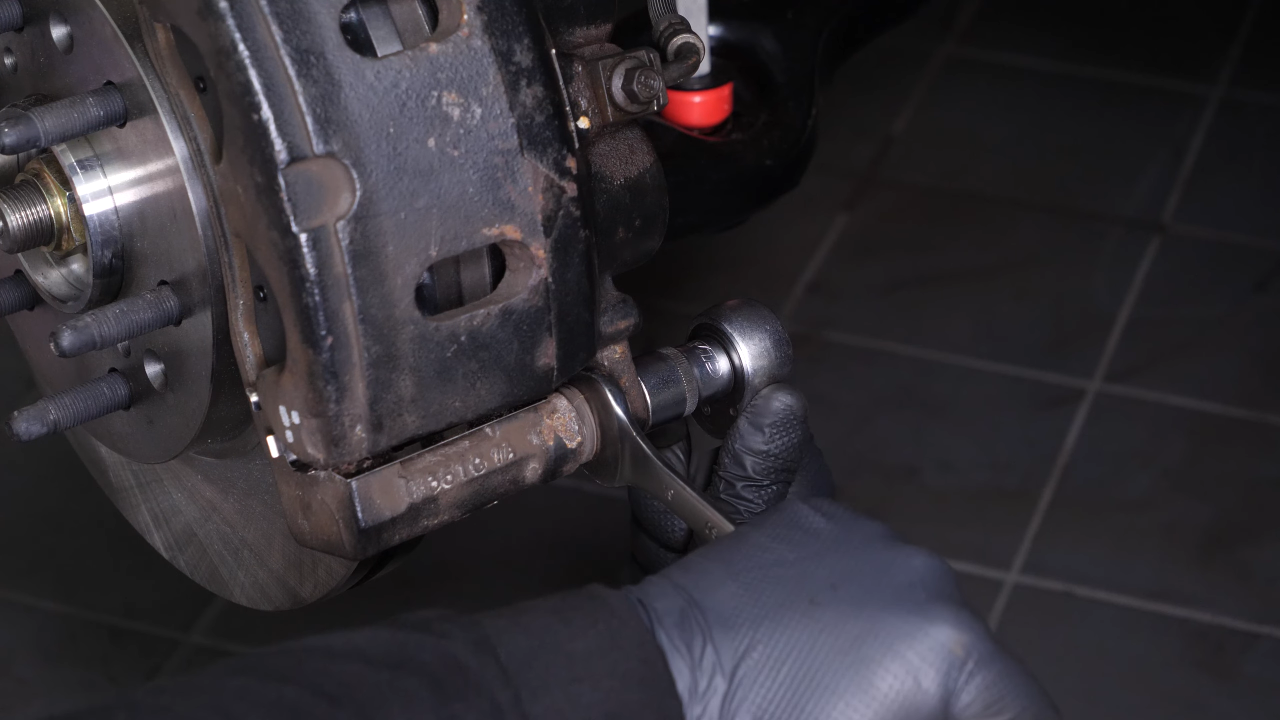 Put the brake caliper back