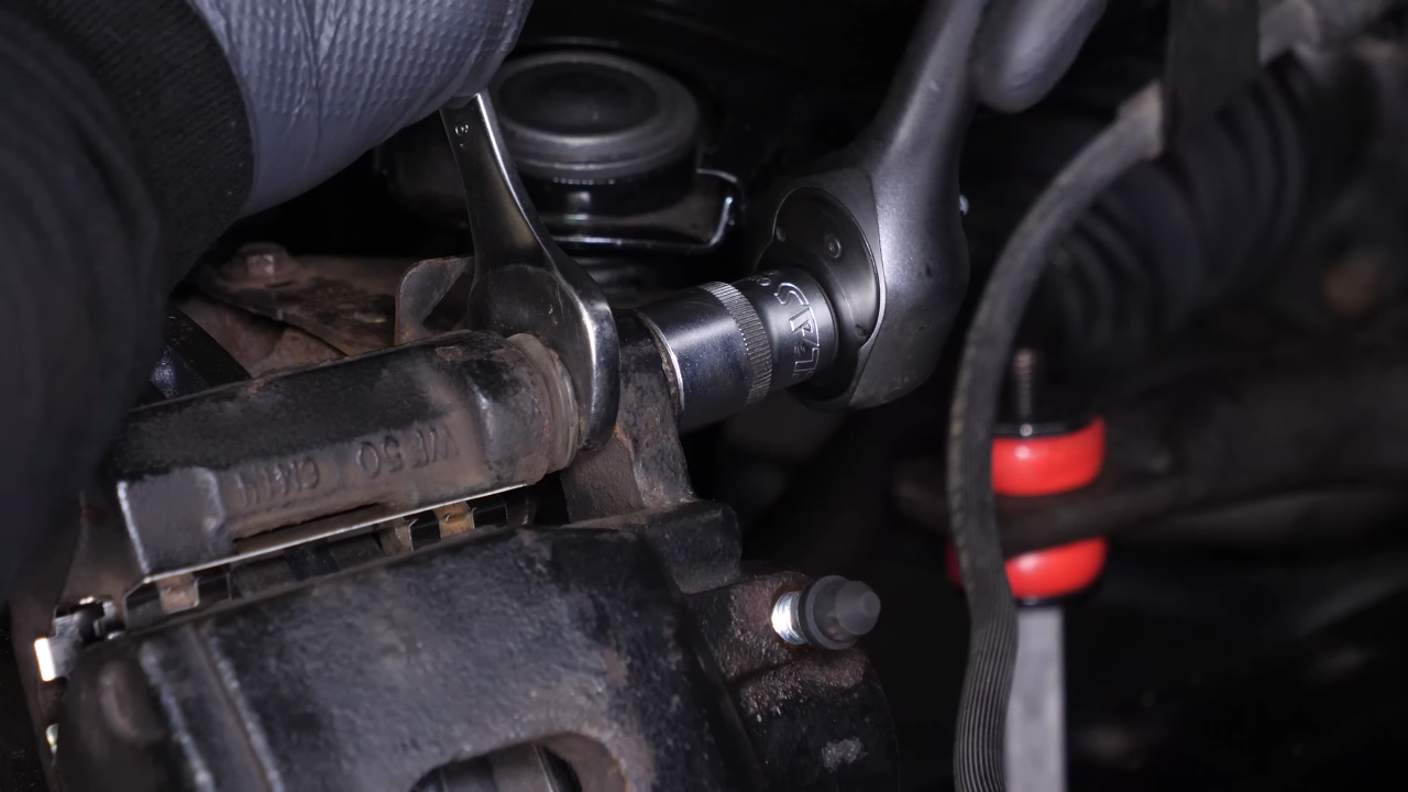 Put the brake caliper back