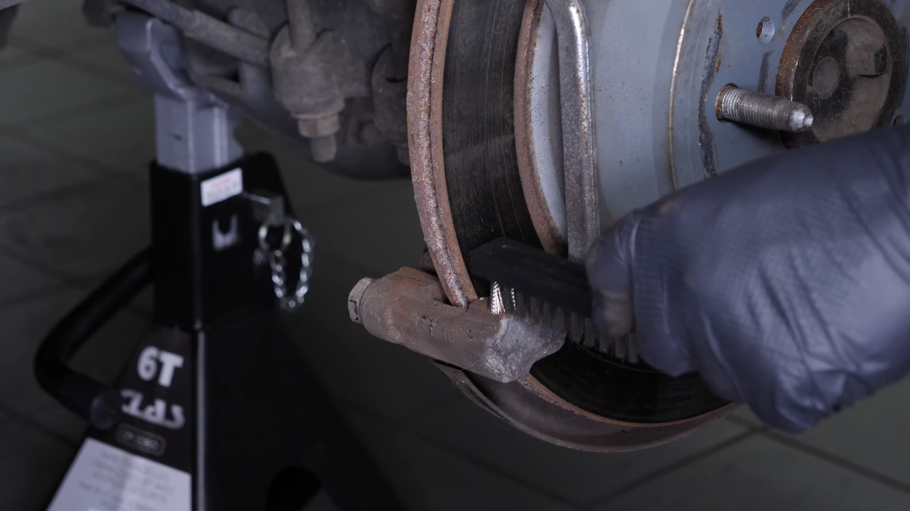 Clean the brake caliper mount