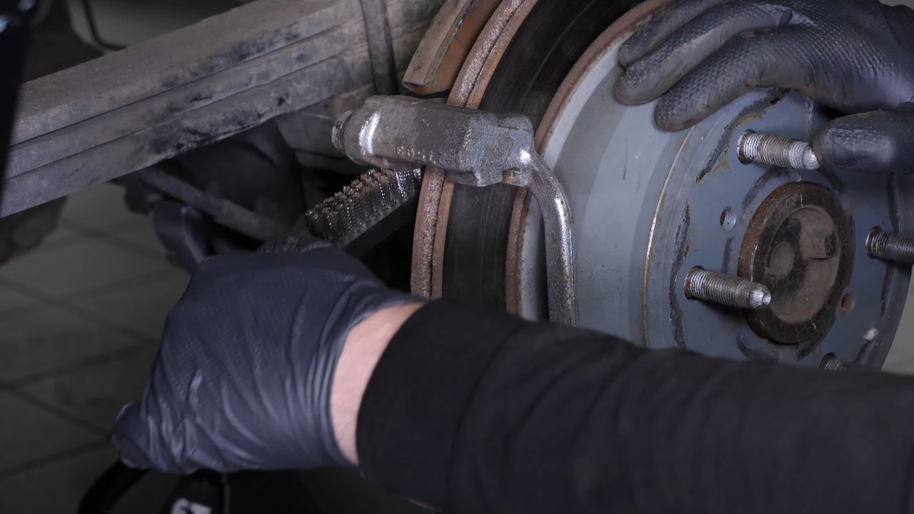 Clean the brake caliper mount